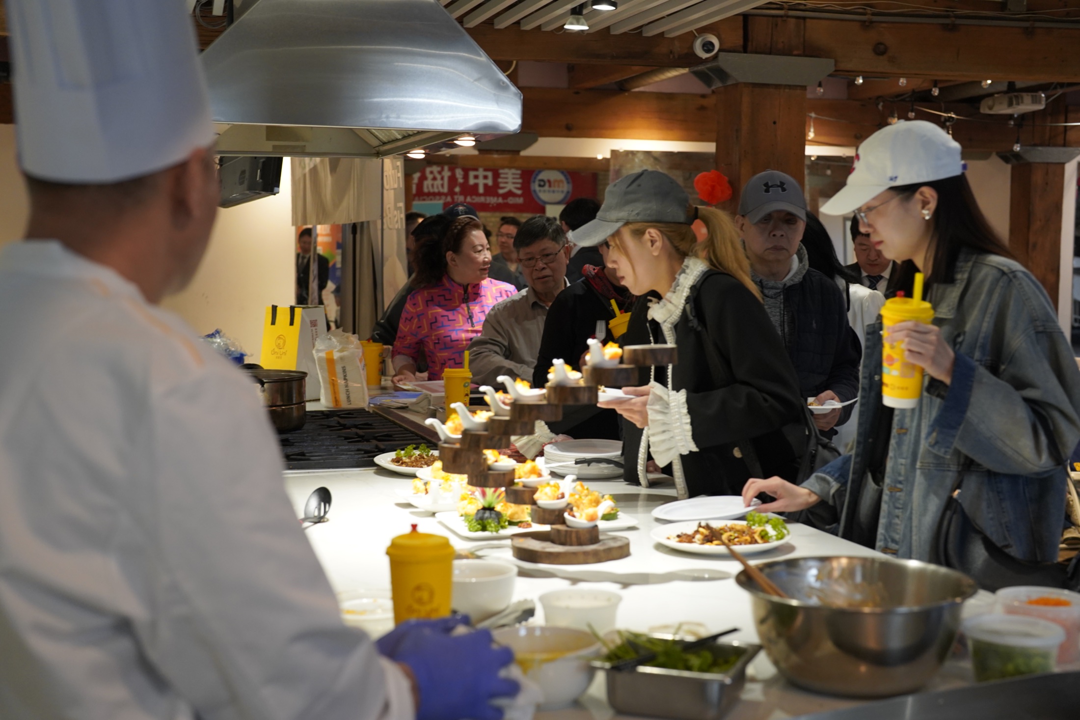 Restaurant professionals experiencing a kitchen demonstration in Chicago